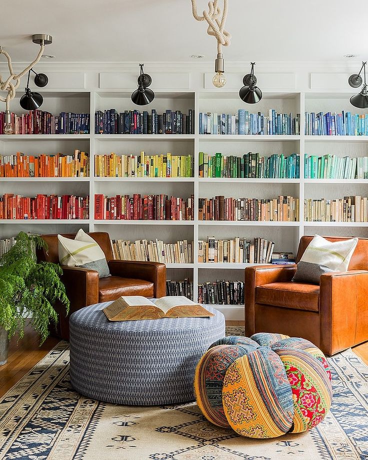 A color coordinated bookshelf will make a space feel bigger and more streamlined