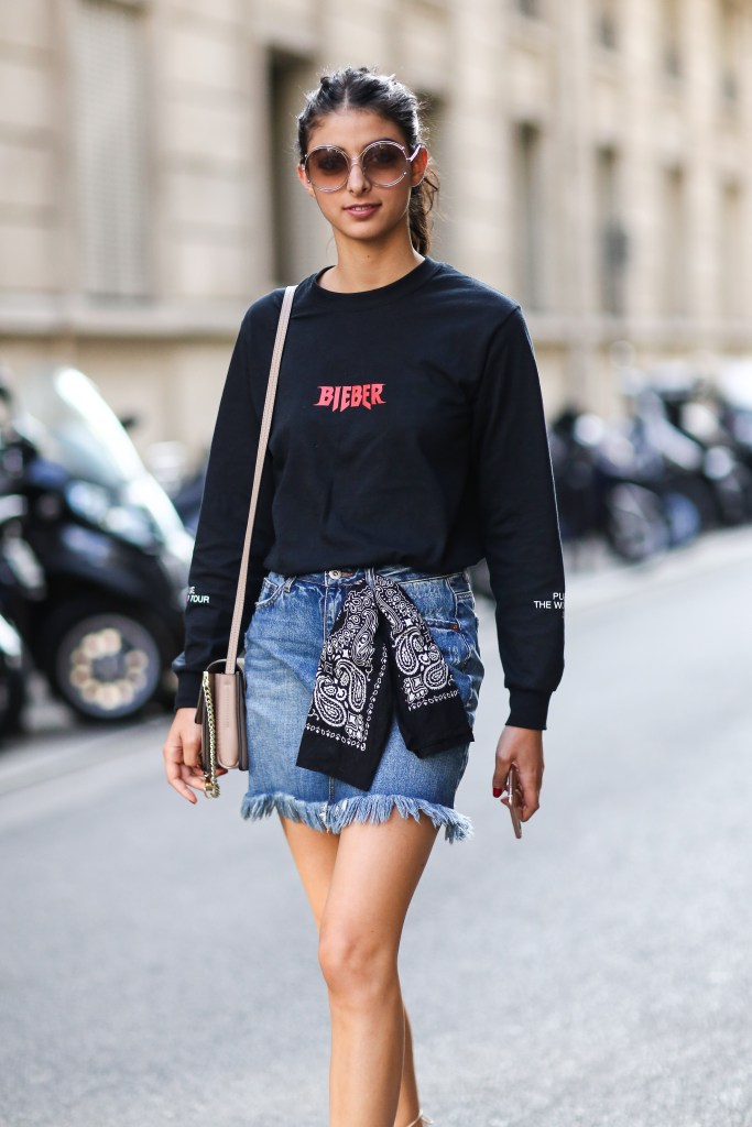 PARIS, FRANCE - JUNE 25: Melanie Darmon is wearing Chloe sunglasses, a Chloe bag, Chloe shoes, a Justin Bieber top, and Levis denim skirt, after the Henrik Vibskov show, during Paris Fashion Week Menswear Spring/summer 2017, on June 25, 2016 in Paris, France. (Photo by Edward Berthelot/Getty Images)