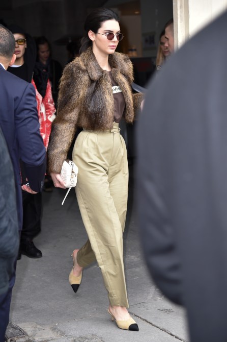 Kendall Jenner Style: Kendall wearing a faux fur jacket and loose-fitting tan pants at Paris Fashion Week in 2017.