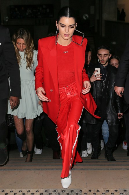 Kendall Jenner Style: Kendall Jenner wearing an all-red look, including red sweatpants and a red blazer, as she makes her way to a show at Paris Fashion Week in 2017.