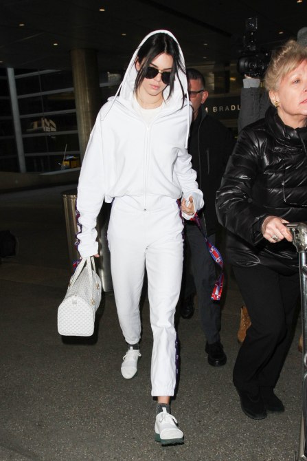 Kendall Jenner Style: Kendall wearing al-white with a white hoodie, sweats and shoes in Los Angeles in 2017.