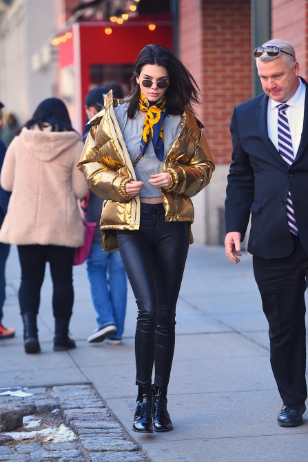 Kendall Jenner Style: Kendall wearing a gold, metallic down coat with a bandana in New York City in 2017