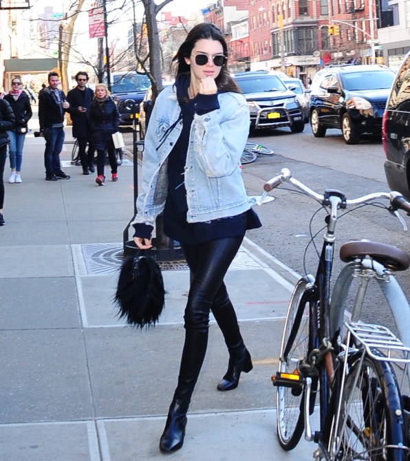 Kendall Jenner Style: Kendall wearing a enim jacket over black, leather pants in 2016.