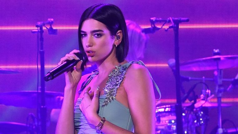 Dua Lipa Hiding In a Puffer Coat Is Relatable AF
