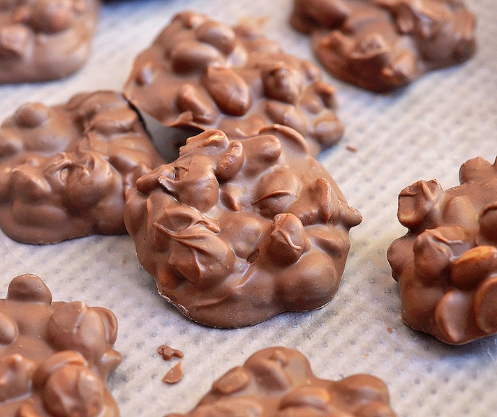 STYLECASTER | 17 Stoner Snacks You Can Actually Whip Up in the Slow-Cooker | Chocolate Peanut Clusters