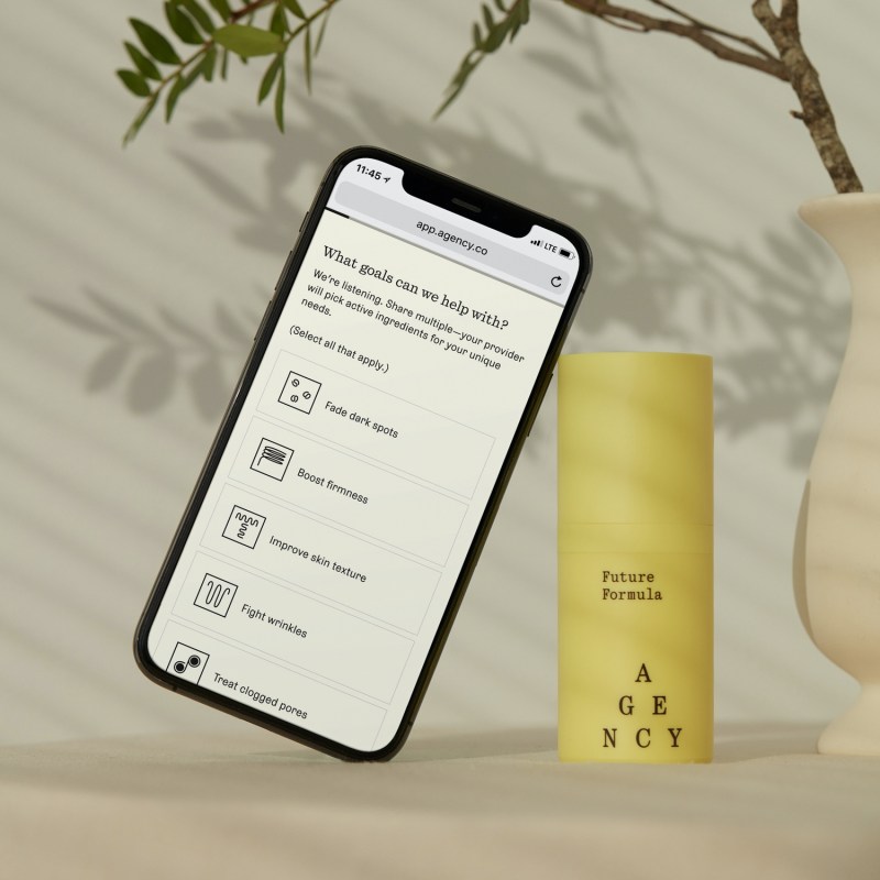 Agency Future Formula bottle with phone with the Agency app opened