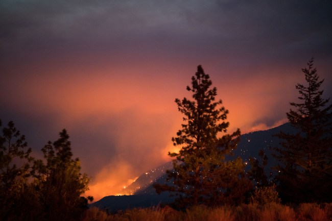 Flames and smoke from wildfires cover the landscape in British Columbia, Canada. Photographer: James MacDonald/Bloomberg