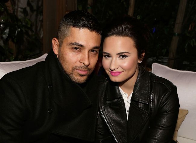 Actor Wilmer Valderrama (L) and singer Demi Lovato wearing Topshop attend the Topshop Topman LA Opening Party at Cecconi's West Hollywood on February 13, 2013 in Los Angeles, California.