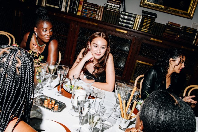 Lola Tung (center) at the COACH Spring 2024 Runway Show and dinner afterparty at the New York Public Library (NYPL) on September 7, 2023 in New York, New York.