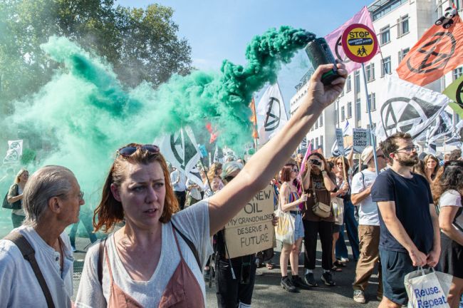 Environmentalists march from Victoria to Parliament square to demand and end to new oil and gas contracts on September 16, 2023 in London, England. This weekend, millions of people around the world take to the streets demanding a rapid, just and equitable end to fossil fuels use.