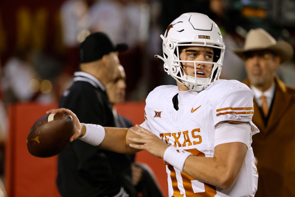 AMES, IA - NOVEMBER 18: Quarterback Arch Manning #16 of the Texas Longhorns throws the ball in pregame warmups at Jack Trice Stadium on November 18, 2023 in Ames, Iowa. The Texas Longhorns won 26-16 over the Iowa State Cyclones. (Photo by David K Purdy/Getty Images)