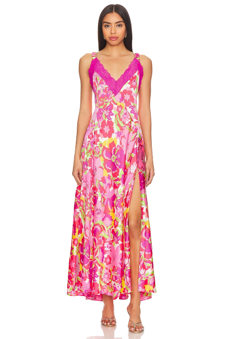 A model wearing the Free People All A Bloom Floral Maxi Nightgown in hot pink