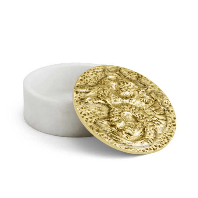 A white jewelry box with a gold dragon-adorned lid from Michael Aram