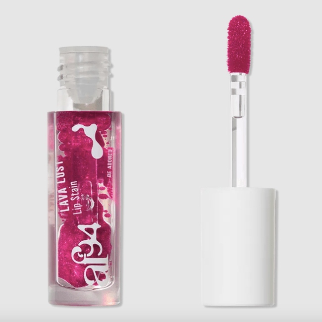 A pink berry colored lip stain that resembles a lava lamp in a clear bottle.