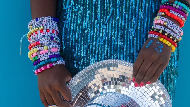 Swiftie wearing friendship bracelets at Eras Tour