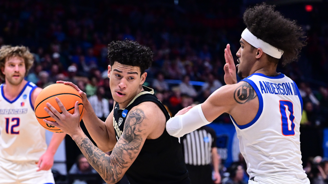 DAYTON, OHIO - MARCH 20: KJ Simpson #2 of the Colorado Buffaloes drives against Roddie Anderson #0 of the Boise State Broncos during the First Four round of the 2024 NCAA Men's Basketball Tournament held at University of Dayton Arena on March 20, 2024 in Dayton, Ohio.