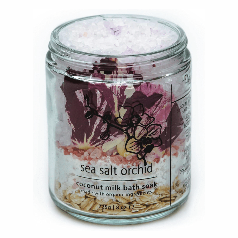 A glass jar full of bath salts and oats