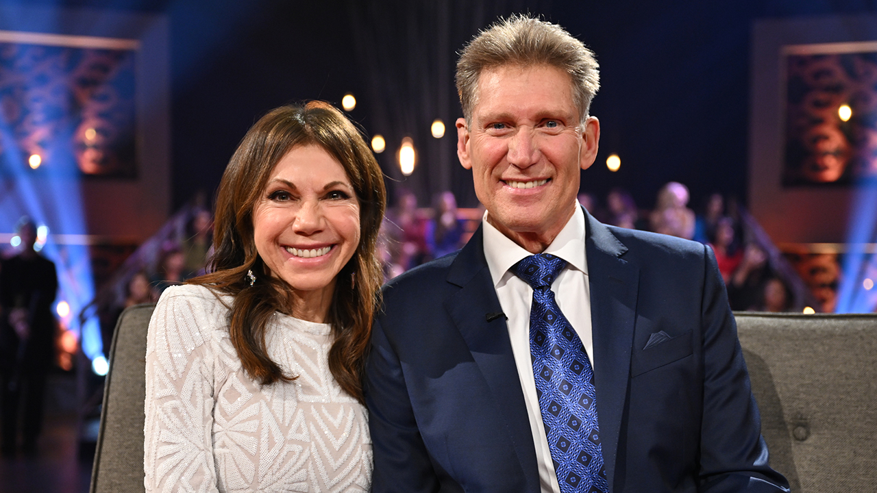 Theresa Nist, an elderly white woman with brown wearing a white dress and Gerry Turner, a white man wearing a suit with a blue tie.