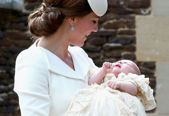Catherine, Duchess of Cambridge and Princess Charlotte of Cambridge arrive at the Church of St Mary Magdalene on the Sandringham Estate for the Christening of Princess Charlotte of Cambridge on July 5, 2015 in King's Lynn, England.