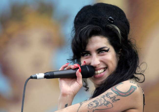 Amy Winehouse performs on stage on the second day of the Isle of Wight Festival 2007, at Seaclose Park in Newport June 9 2007 on the Isle Wight, England. The three day festival - which was first held in 1970 when Jimi Hendrix made his last public appearance - features headline acts, Snow Patrol, Muse and the Rolling Stones.