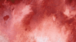 Blotchy red watercolor paint