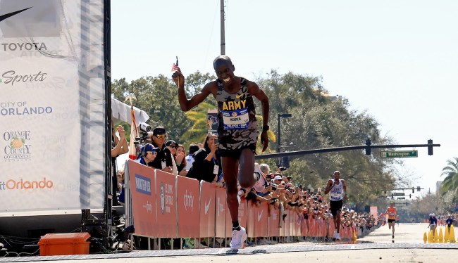 Leonard Korir crosses the finish line to place third during the 2024 U.S. Olympic Team Trials - Marathon on February 03, 2024 in Orlando, Florida.