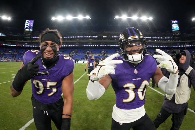 Baltimore Ravens linebacker Tavius Robinson (95) and linebacker Trenton Simpson (30) celebrate after the AFC Divisional Playoff game against the Houston Texans at M&T Bank Stadium on January 20, 2024 in Baltimore, Maryland. The Ravens defeated the Texans 34-10.