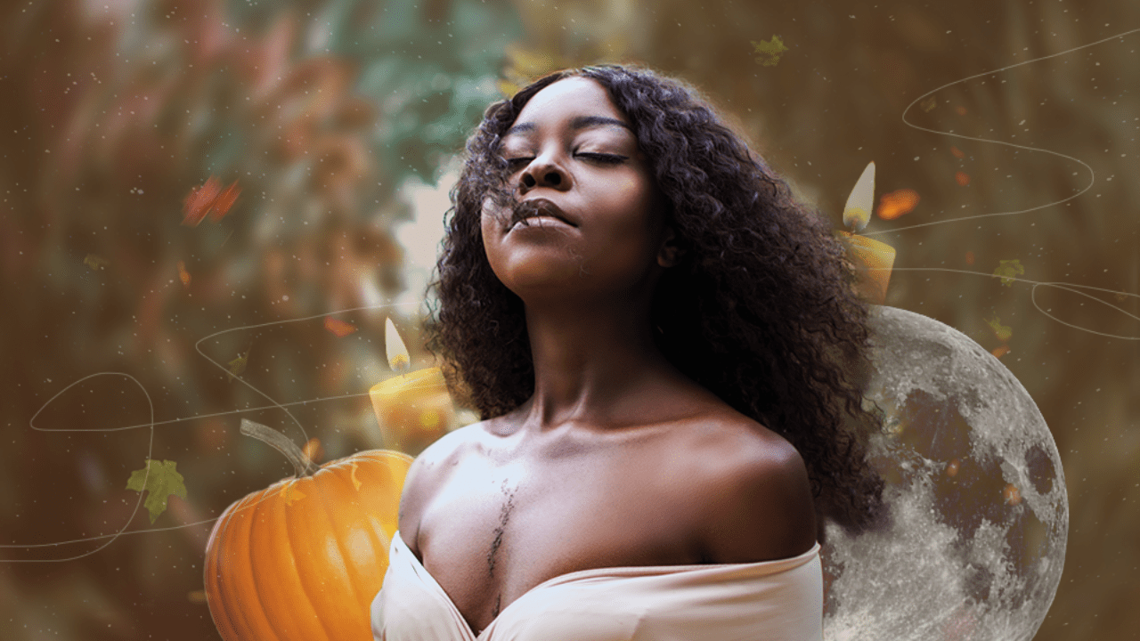 A young woman feeling the autumn wind flow through her hair, standing in front of a fall backdrop that includes a pumpkin and a full moon