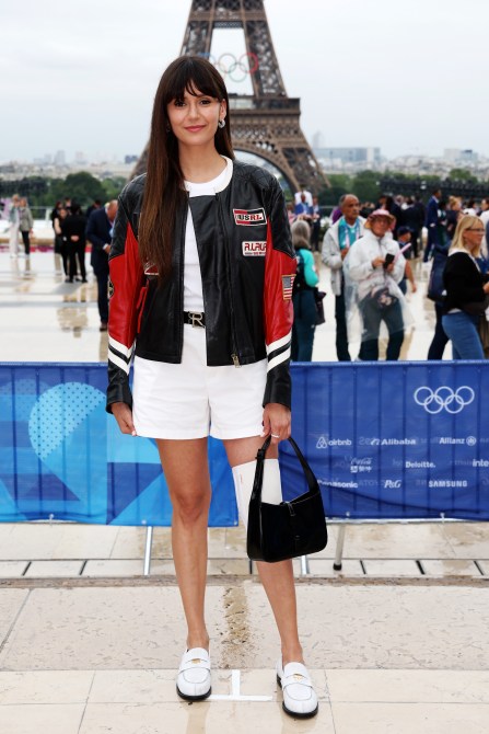 Nina Dobrev poses for a photo in Paris