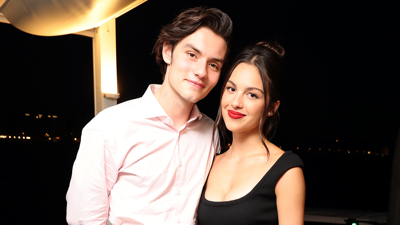 VENICE, ITALY - AUGUST 30: (EXCLUSIVE COVERAGE) Louis Partridge (L) and Olivia Rodrigo celebrate the Venice International Film Festival World Premiere of the Apple TV+ limited series “DISCLAIMER” at Harry's Dolci on August 30, 2024 in Venice, Italy. “DISCLAIMER” will premiere globally on Apple TV+ on October 11, 2024.