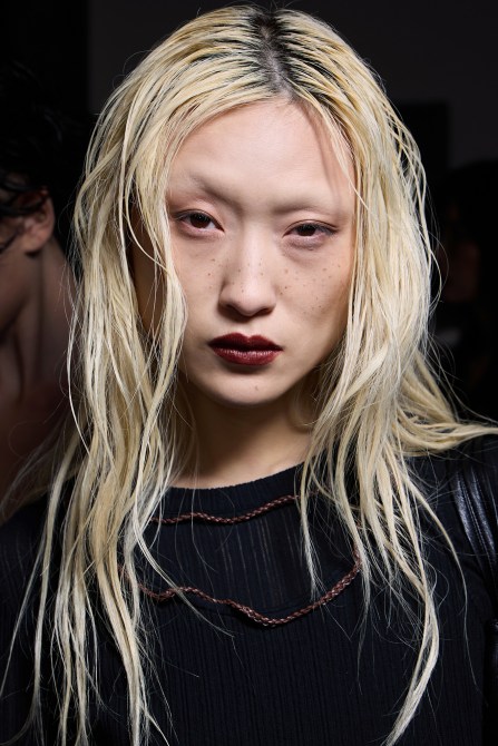 A model wearing faux freckles.