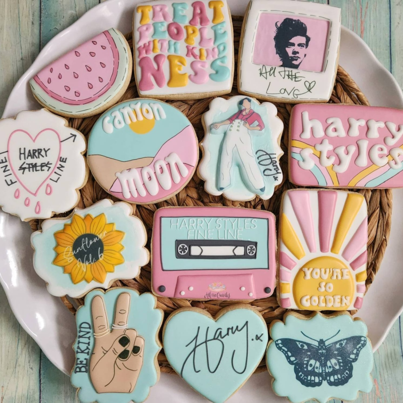 A plate of colorful Harry Styles cookies