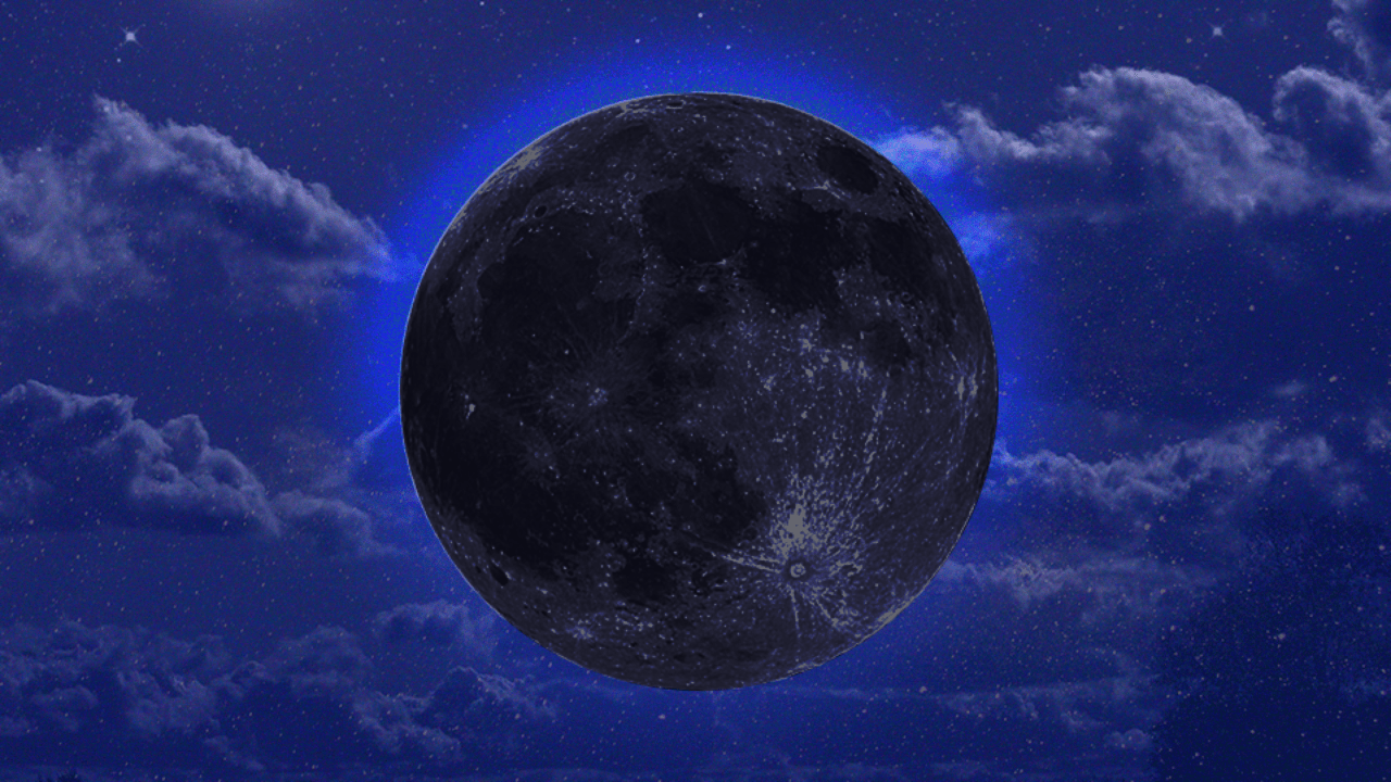 A black moon/new moon hanging in front of a deep blue night sky