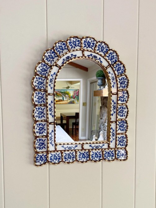 A mirror with a patterned frame