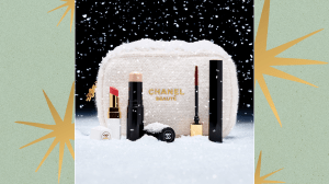 A Chanel makeup gift set with a white woven Chanel pouch.