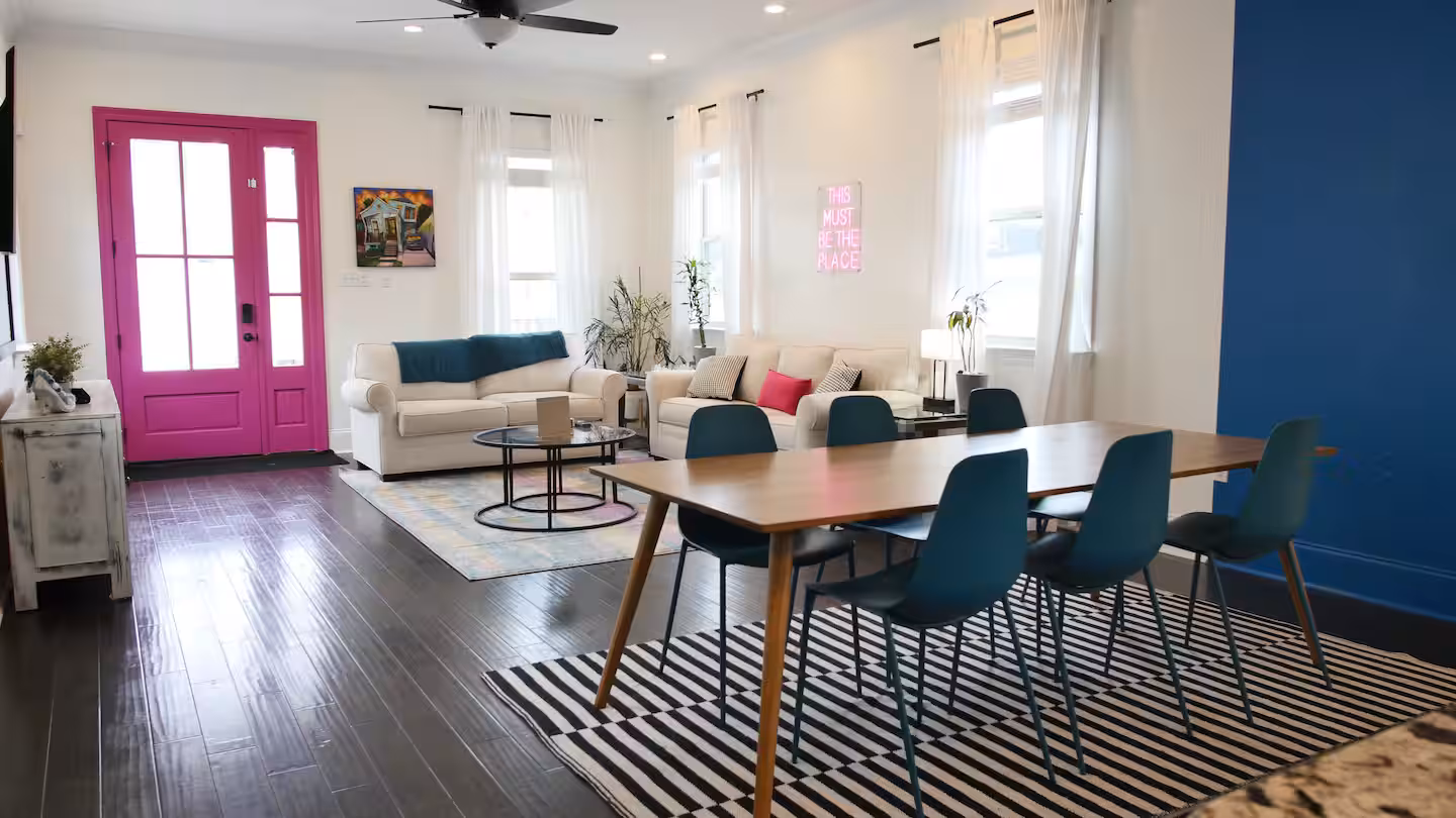 Living room view with dining table and couches
