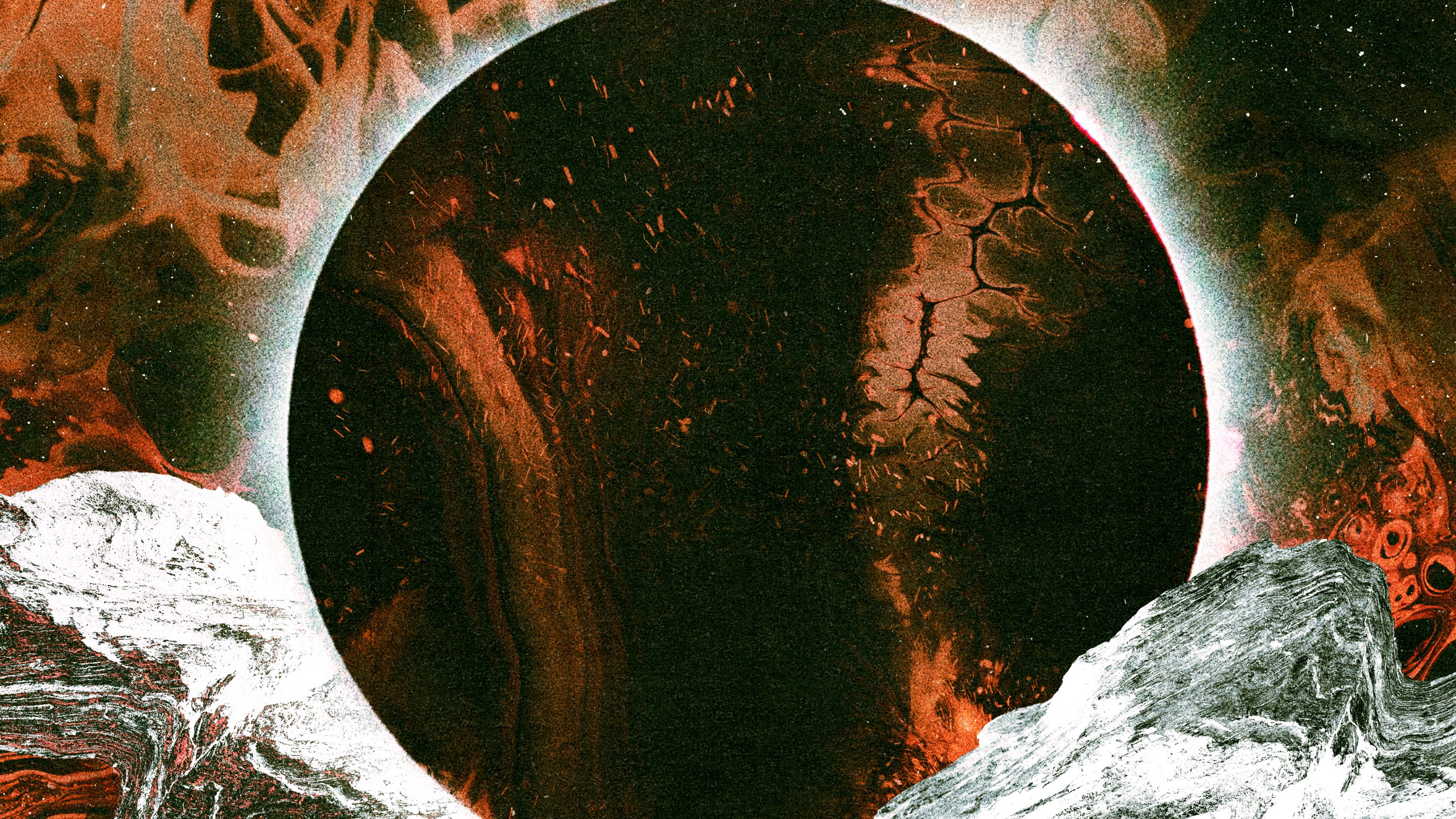 A solar eclipse over a black and orange backdrop