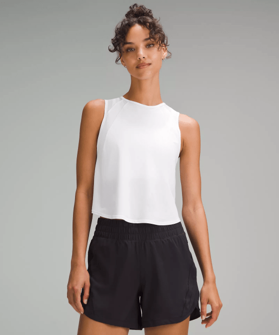A model wearing the Lululemon Sculpt Cropped Tank Top Pleated in white