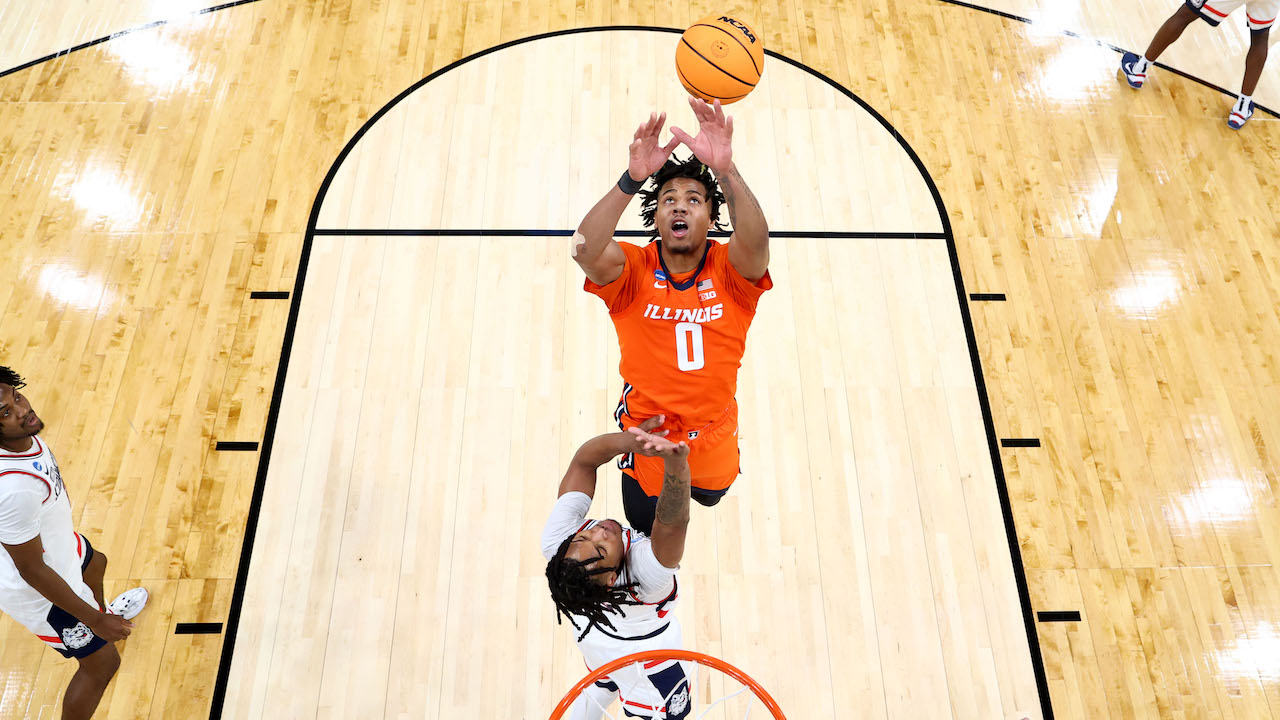 Watch March Madness live for free in 2025 to see intense battles like this rebound struggle between Illinois' Shannon Jr. and UConn's Castle from 2024.