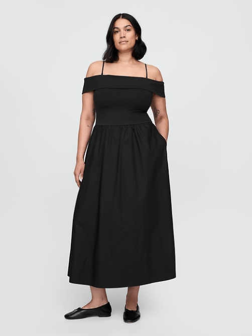 A model wearing the GAP Mixed Media Off-Shoulder Midi Dress in black