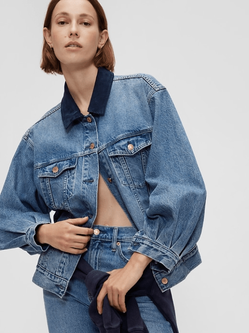 A model wearing the Gap x Dôen Oversized Icon Denim Jacket in a medium blue wash