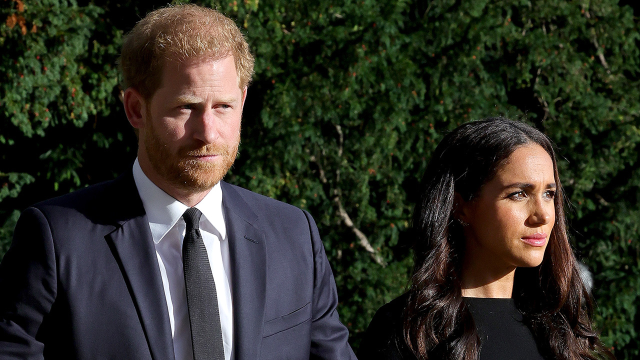 WINDSOR, ENGLAND - SEPTEMBER 10: Prince Harry, Duke of Sussex, and Meghan, Duchess of Sussex on the long Walk at Windsor Castle arrive to view flowers and tributes to HM Queen Elizabeth on September 10, 2022 in Windsor, England. Crowds have gathered and tributes left at the gates of Windsor Castle to Queen Elizabeth II, who died at Balmoral Castle on 8 September, 2022