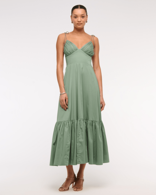 A model wearing the Abercrombie & Fitch Tie-Strap Tiered Maxi Dress in green