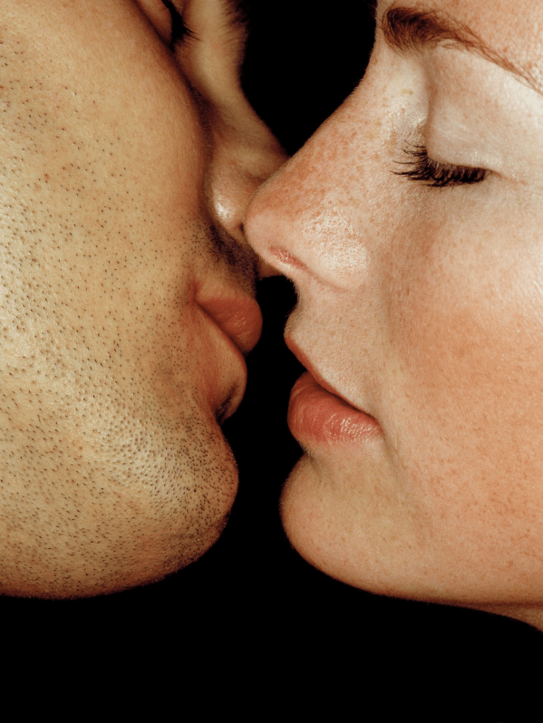 A man and a woman about to kiss