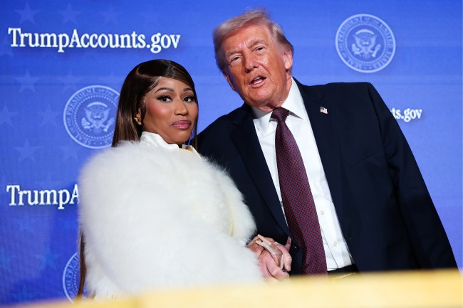 WASHINGTON, DC - JANUARY 28: Musician Nicki Minaj (L) joins U.S. President Donald Trump on stage as he delivers remarks during the Treasury Department's Trump Accounts Summit at Andrew W. Mellon Auditorium on January 28, 2026 in Washington, DC. "Trump Accounts" are a portion of recently passed tax and spending legislation where the federal government will deposit $1,000 into investment accounts for every child born between 2025 and 2028 once parents sign their children up while filing their income taxes. 