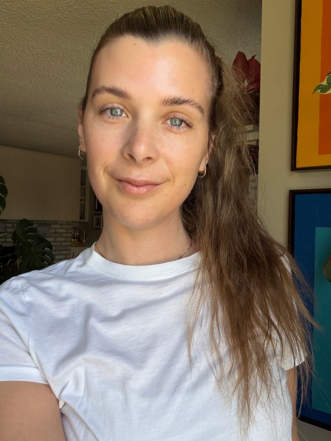 A brunette woman in a ponytail