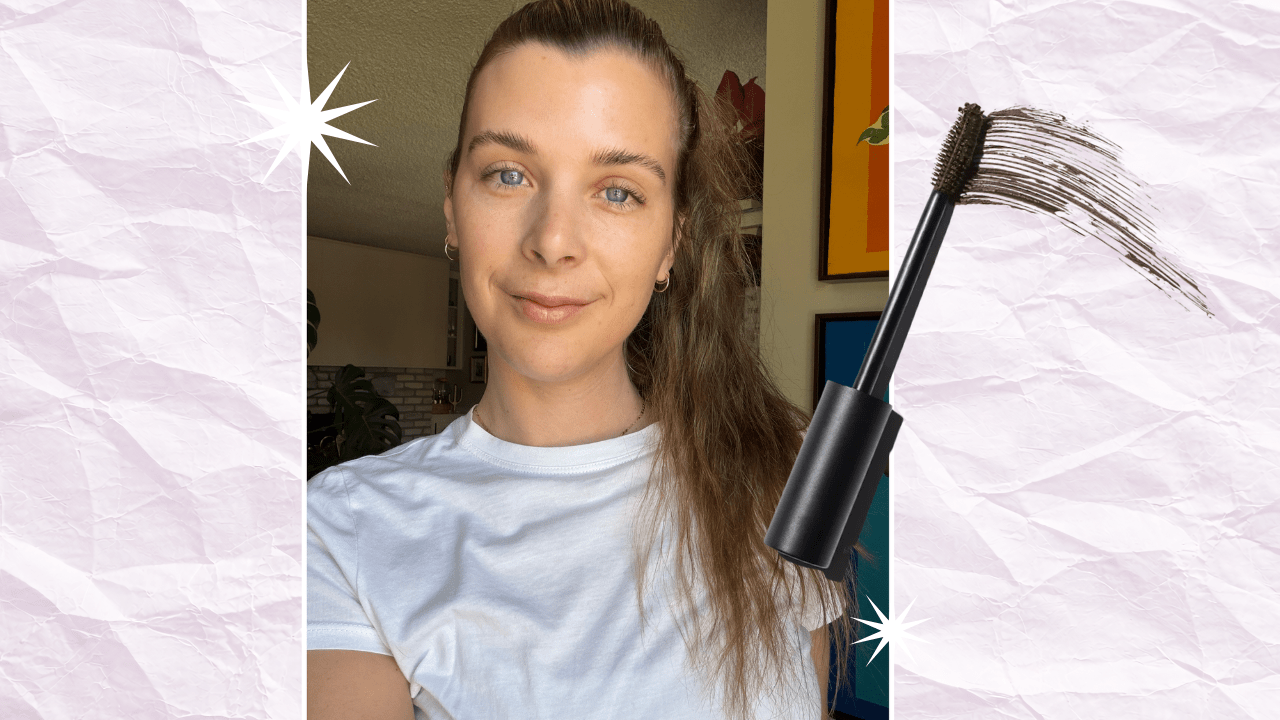 A light pink background that looks like crumpled paper, with a photo of a brunette woman in a ponytail and a brown mascara wand.