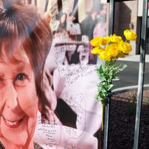 A photograph of Nancy Guthrie is displayed on a banner in front of the KVOA television station in March 2026.