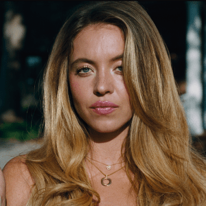 Sydney Sweeney's character holding a melting ice cream cone and staring into the camera, in Euphoria Season 3