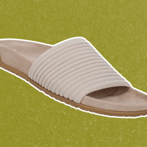 Vionic slide sandals on a green background
